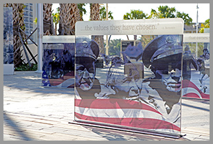 Several memorials at the plaza, the nearest reads "... the values they have chosen."